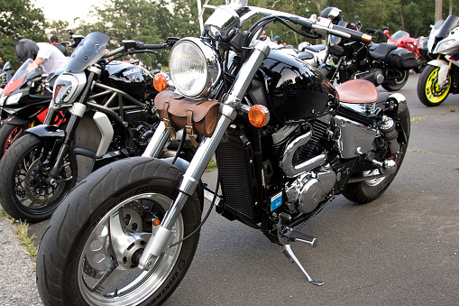 Bear Mountain State Park, New York, USA – August 25, 2021: Motorcycles in a row at the Car Cruise Rally held weekly in the summer at the state park.