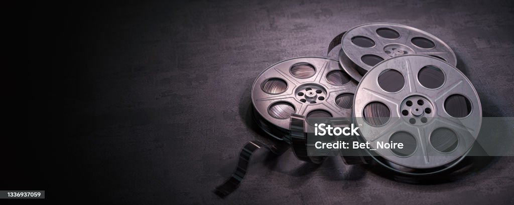 Film reels on black background. Movie, video and cinema prodaction and edition concept. Film reels on black background. Movie, video and cinema prodaction and edition concept. 3d illustration Movie Stock Photo