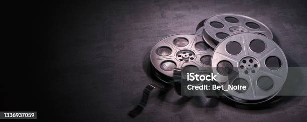 Film Reels On Black Background Movie Video And Cinema Prodaction And Edition Concept Stock Photo - Download Image Now