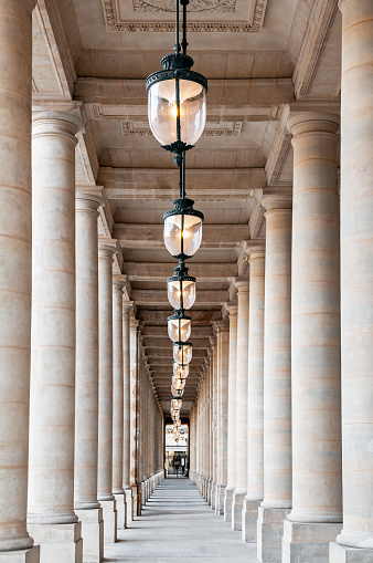 Colonnade in Palais Royal, near Colonnes de Buren, Conseil d'Etat and Conseil Constitutionnel. Paris in France. March 15, 2021