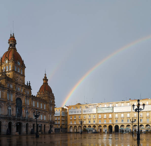 Rainbow in Coruña Cityscape, photograph of the Plaza de María Pita on a rainy day with the rainbow in the sky a coruna province stock pictures, royalty-free photos & images