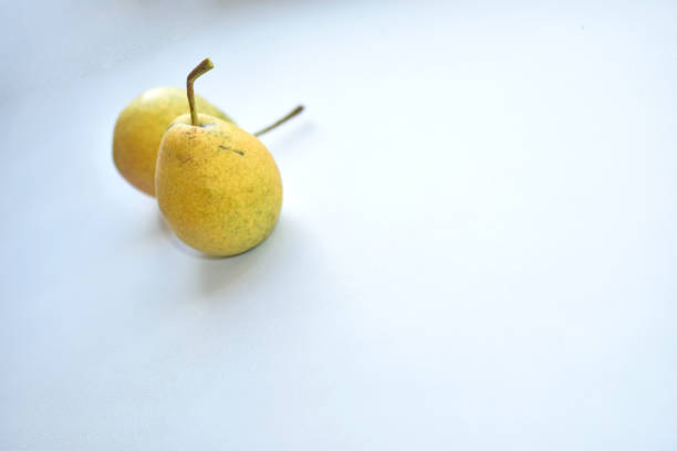 Yellow ripe pears on a white background