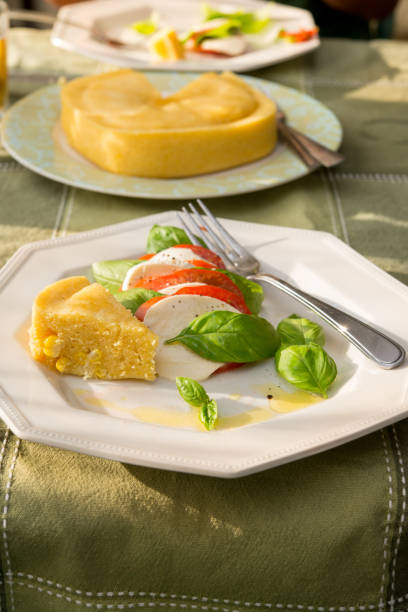 Organic heirloom tomatoes, water buffalo fresh cheese, fresh basil, corn bread
