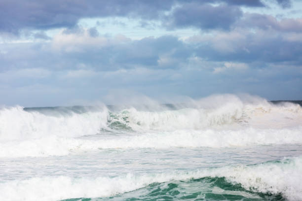 Photo of Big ocean waves in the wind, beautiful nature background with copy space