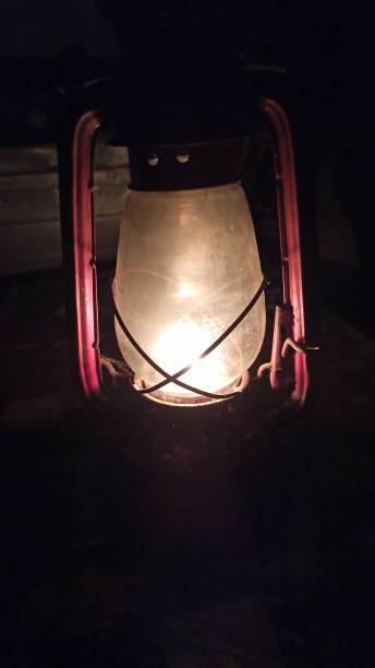 istock Lighting an oil lamp.. 1336953259