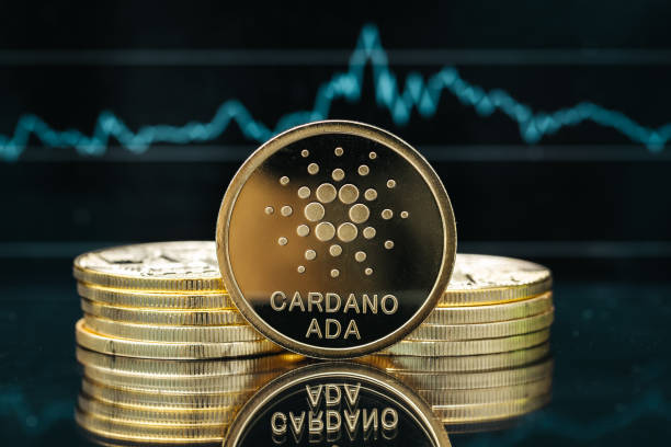Cardano Ada cryptocurrency coin close-up, in front of a price chart Physical Cardano cryptocurrency coin close-up, in front of a price chart altcoin photos stock pictures, royalty-free photos & images