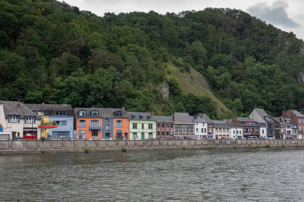 istock Generic older houses just upriver right shore from Dinant, Belgium. 1336956019