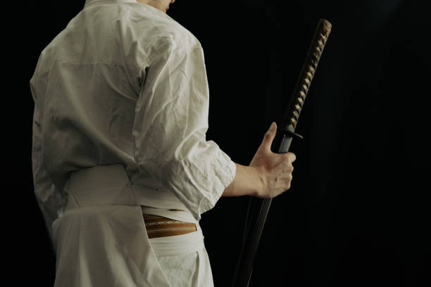 istock Portrait of samurai and his japanese sword 1336956125