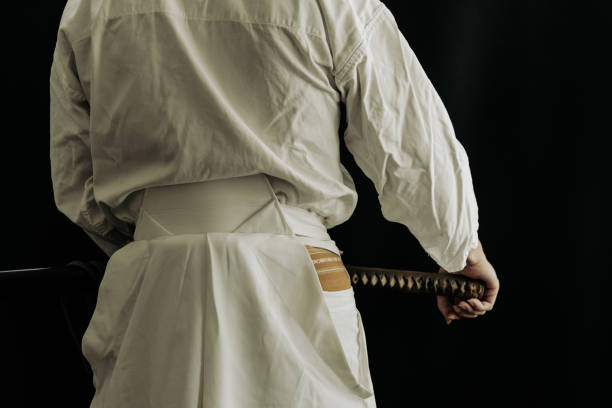 istock Portrait of samurai and his japanese sword 1336956154