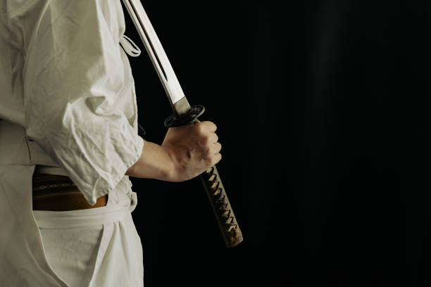 istock Portrait of samurai and his japanese sword 1336956175