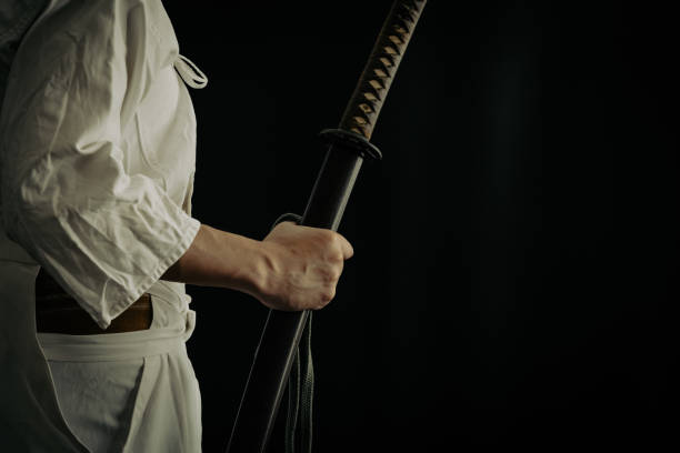 istock Portrait of samurai and his japanese sword 1336956177