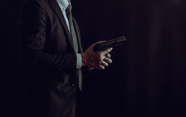 istock A man holding pistol 1336957803
