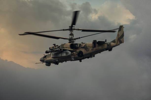 istock Military helicopter in the sky 1336959416