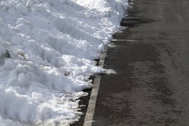 istock road white lines winter snow danger traffic 1336959706