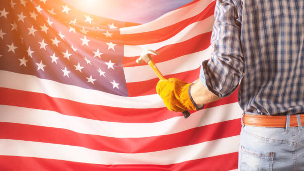 istock Worker on nation flag background. Labor day holiday concept. USA 1336960021