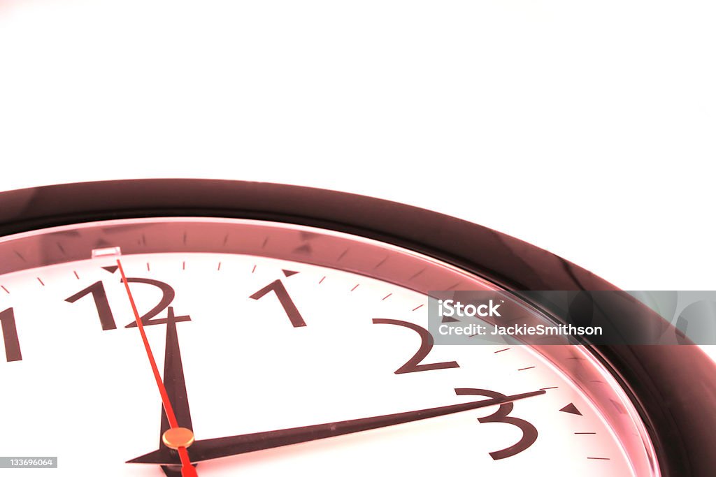 Red Clock Cropped clock with a red tinge Minute Hand Stock Photo