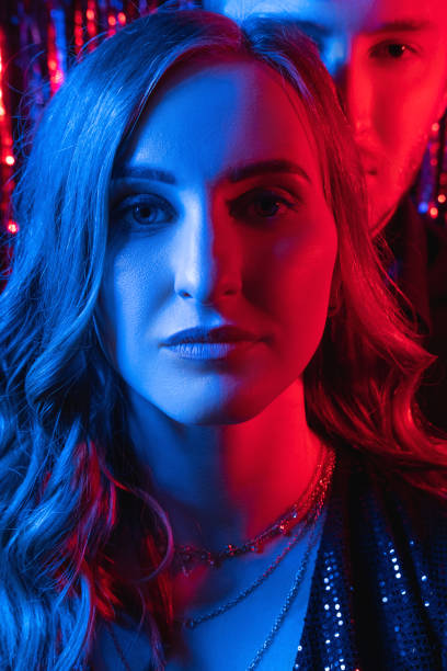 istock neon light couple festive portrait disco night 1336961833