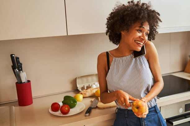 istock Merry young cook chatting on the cellphone 1336962190