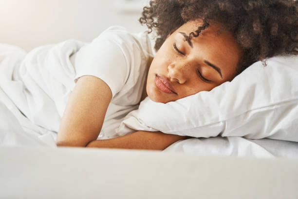 istock Pretty lady napping in bed in the morning 1336962215