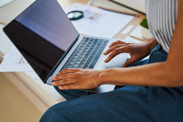 istock African American draftswoman typing on her laptop 1336966299