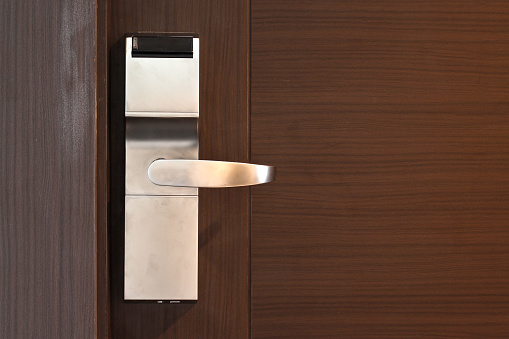 hotel electronic card lock on wooden door