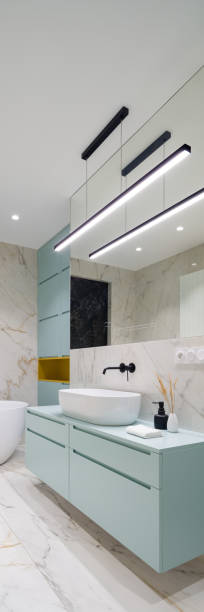 istock Bathroom with modern blue cabinets, vertical panorama 1336969991