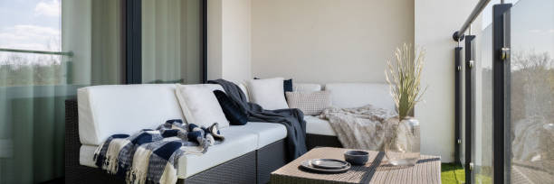 istock Nice balcony with rattan furniture, panorama 1336969993