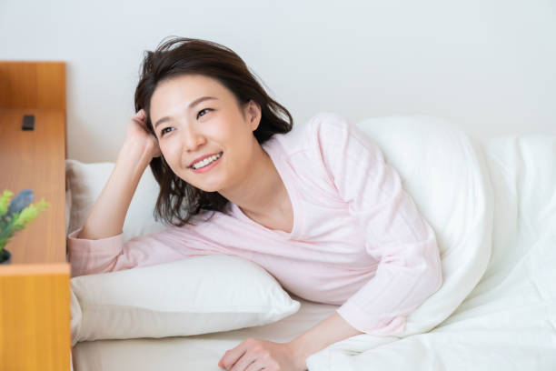 istock asian woman in night clothes,Smile 1336971657
