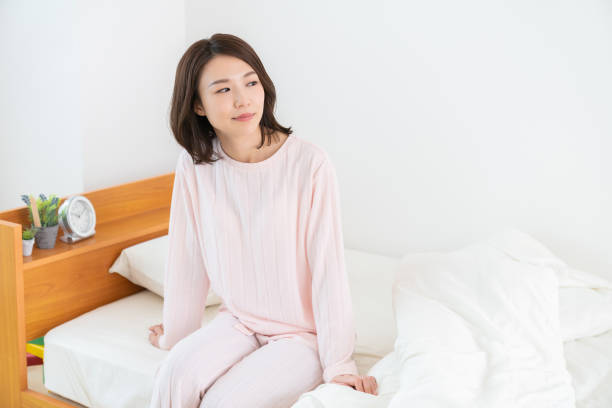 istock asian woman in night clothes,Smile 1336971673