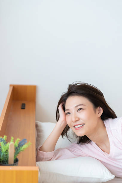 istock asian woman in night clothes,Smile 1336971693