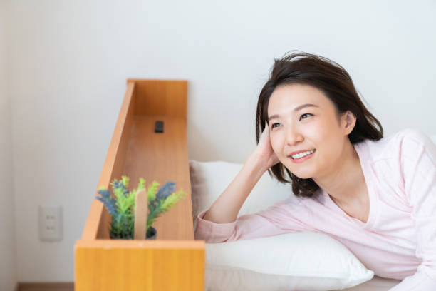istock asian woman in night clothes,Smile 1336971701
