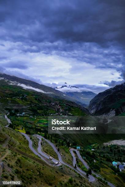 Beautiful Meandering Roads In Lahaul Valley Overseen By The Majestic Ghepang Goh Mountain Stock Photo - Download Image Now