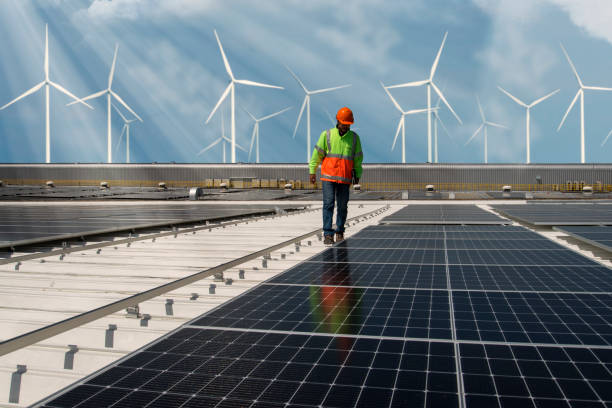 environment  engineer  concept Inspector Engineer Man Holding Digital Tablet Working in Solar Panels Power Farm, Photovoltaic Cell Park, Green Energy Concept. industrial windmill stock pictures, royalty-free photos & images