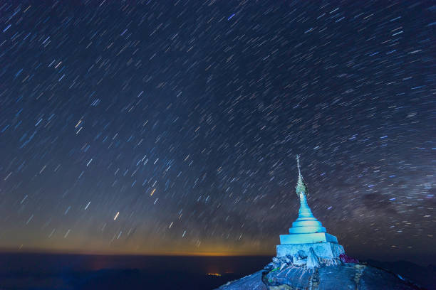 Beautiful night landscape The colorful star trails on the sky. Night time lapse photography. Beautiful night landscape The colorful star trails on the sky. Night time lapse photography. stars in your eyes stock pictures, royalty-free photos & images