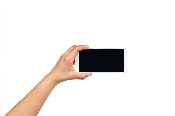 istock hand holding black screen mobile phone isolated on white background with the clipping path. 1336986612