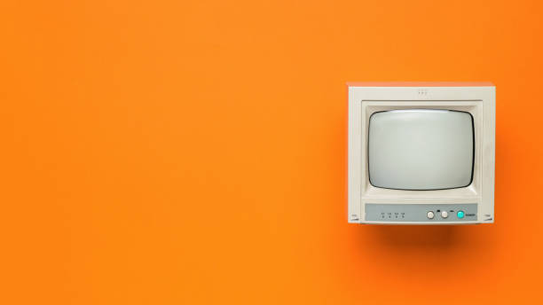 istock Vintage TV on an orange background. Space for the text. Flat lay. 1336988257
