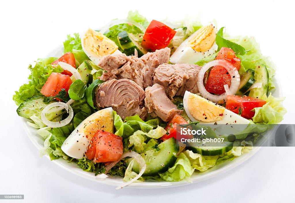 Tuna and vegetables Tuna, boiled eggs, tomatoes, lettuce, cucumber and onion Tuna - Seafood Stock Photo