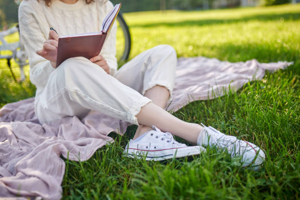 istock A young girl with a diary in hands thinking and making notes 1336995778