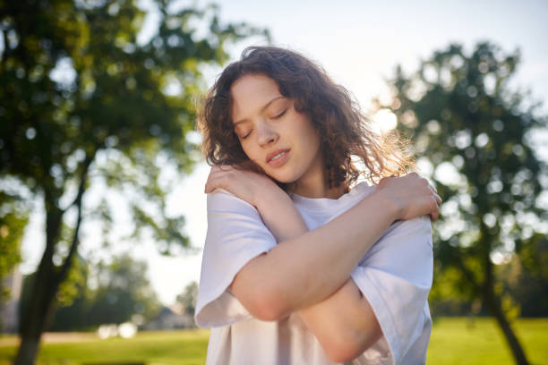 istock A ginger curly-haired girl looking relaxed and tranquil 1336995883