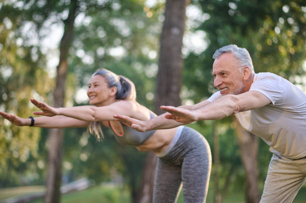 istock A mid aged couple having a workout in the park 1336998398