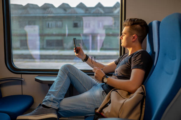 istock Young Man Traveling In Train 1336999304