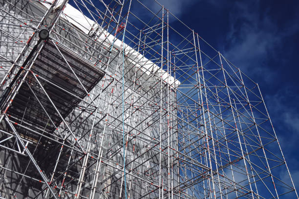 istock Scaffolding metal steel structure, construction on blus sky background or backdrop. August 2021. Tallinn, Estonia, Europe 1336999572