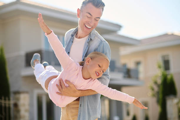 istock Dad and little daughter playing plane 1337001412