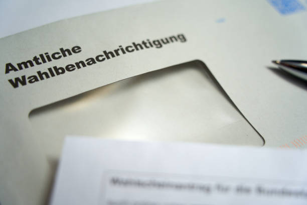 Official election notification (german: Amtliche Wahlbenachrichtigung). 2021 federal election in germany. Closeup. Europe. Official election notification (german: Amtliche Wahlbenachrichtigung). 2021 federal election in germany. Closeup. Europe. german federal elections photos stock pictures, royalty-free photos & images