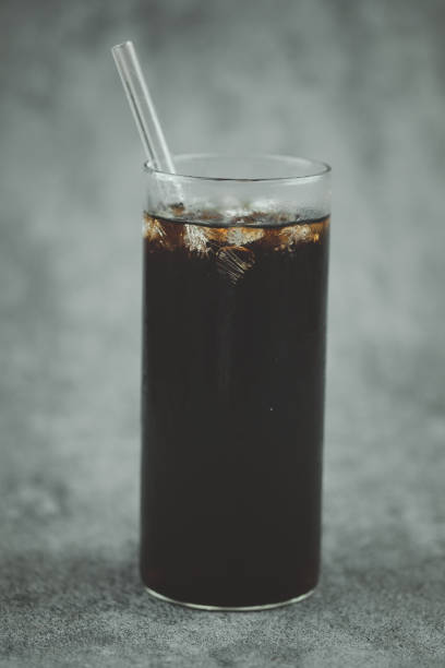 istock Thai style ice black coffee in a tall glass. Cold summer drink 1337003340