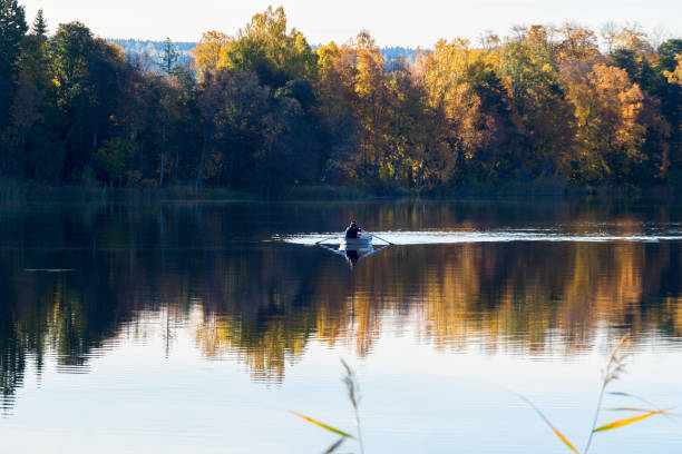 Skara, Sweden - October 12, 2017: Men rowing on the lake