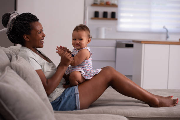 istock Happy mom with baby at home. 1337008096