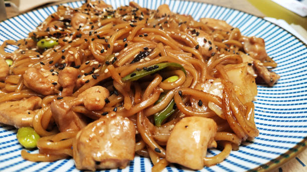 istock chinese noodle dish with chicken 1337015017