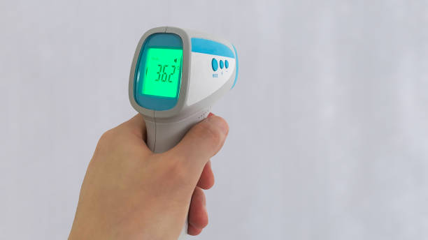 istock Non-contact thermometer held in the left hand 1337015121