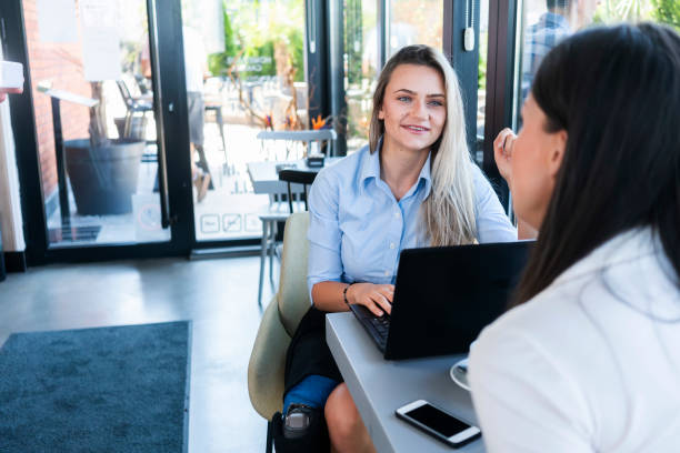istock Contemporary Young Women Working in Cafe  Indoor 1337015197